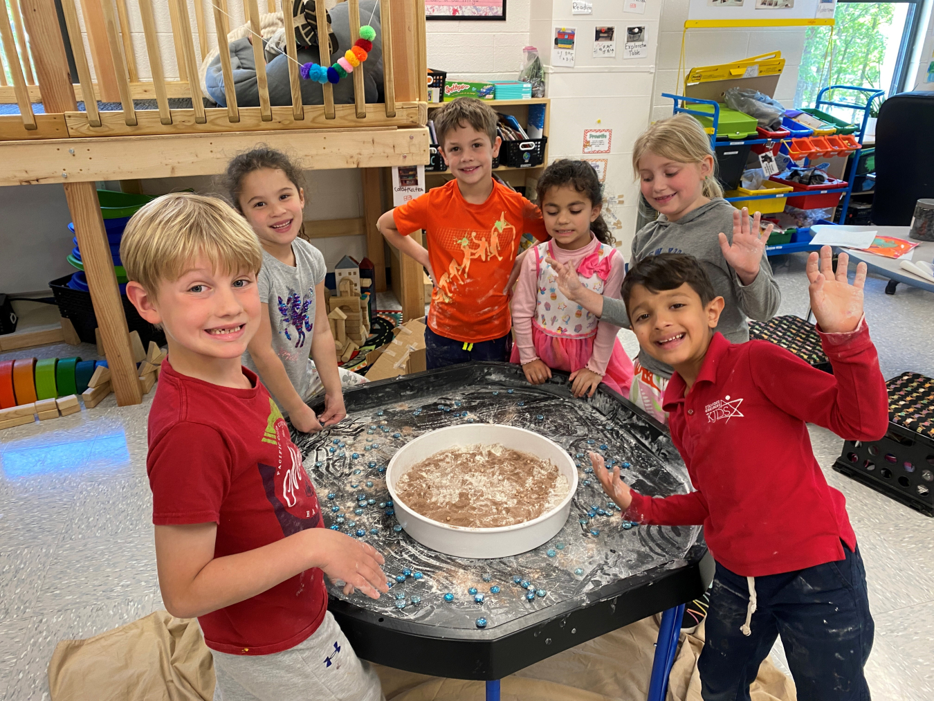 Students at Knoxville Jewish Day School participate in a project titled “We Soar When We Explore.” Here, they are simulating craters on the moon's surface. The school is among the beneficiaries of grants from Oak Ridge cleanup contractor UCOR.