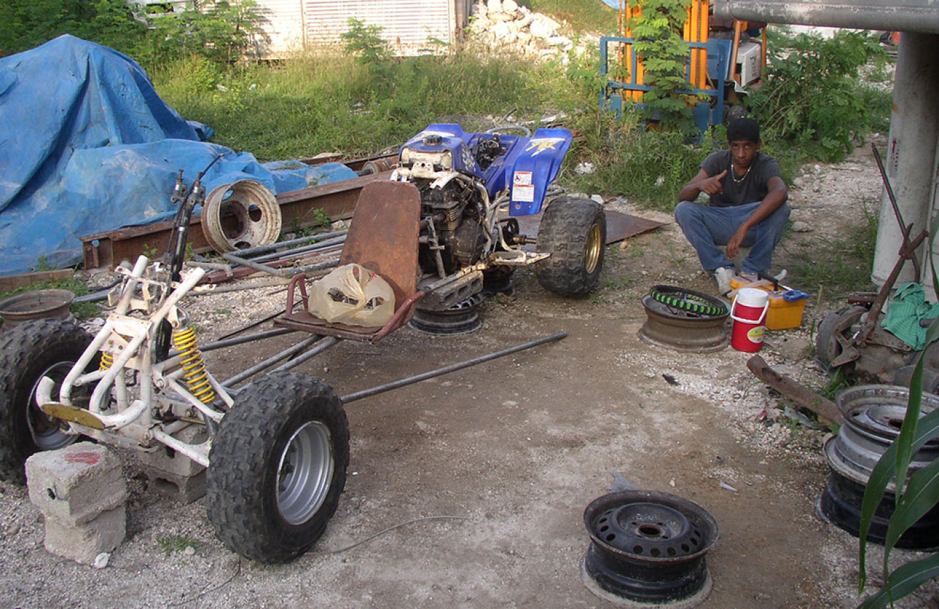 A teenage Brutus helping his brother build the ATV-turned-go-kart.