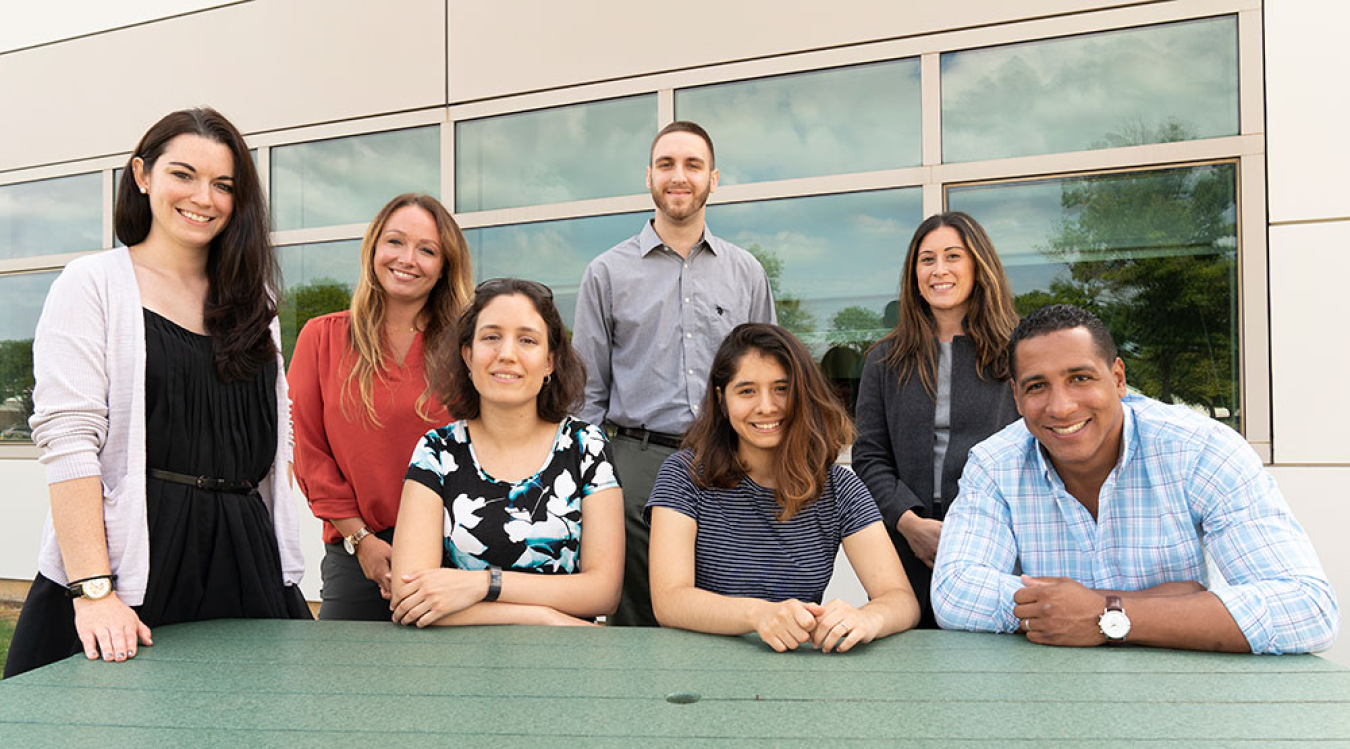 Brutus alongside members of the first Early Career Resource Group (ECRG) leadership team at Brookhaven Lab