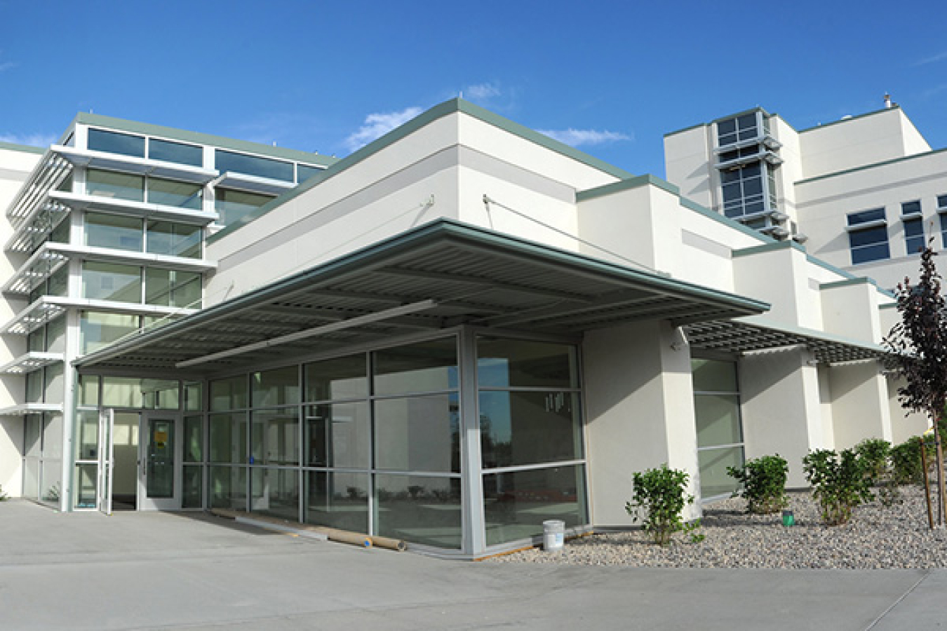 The façade of a building with a large glass entryway.