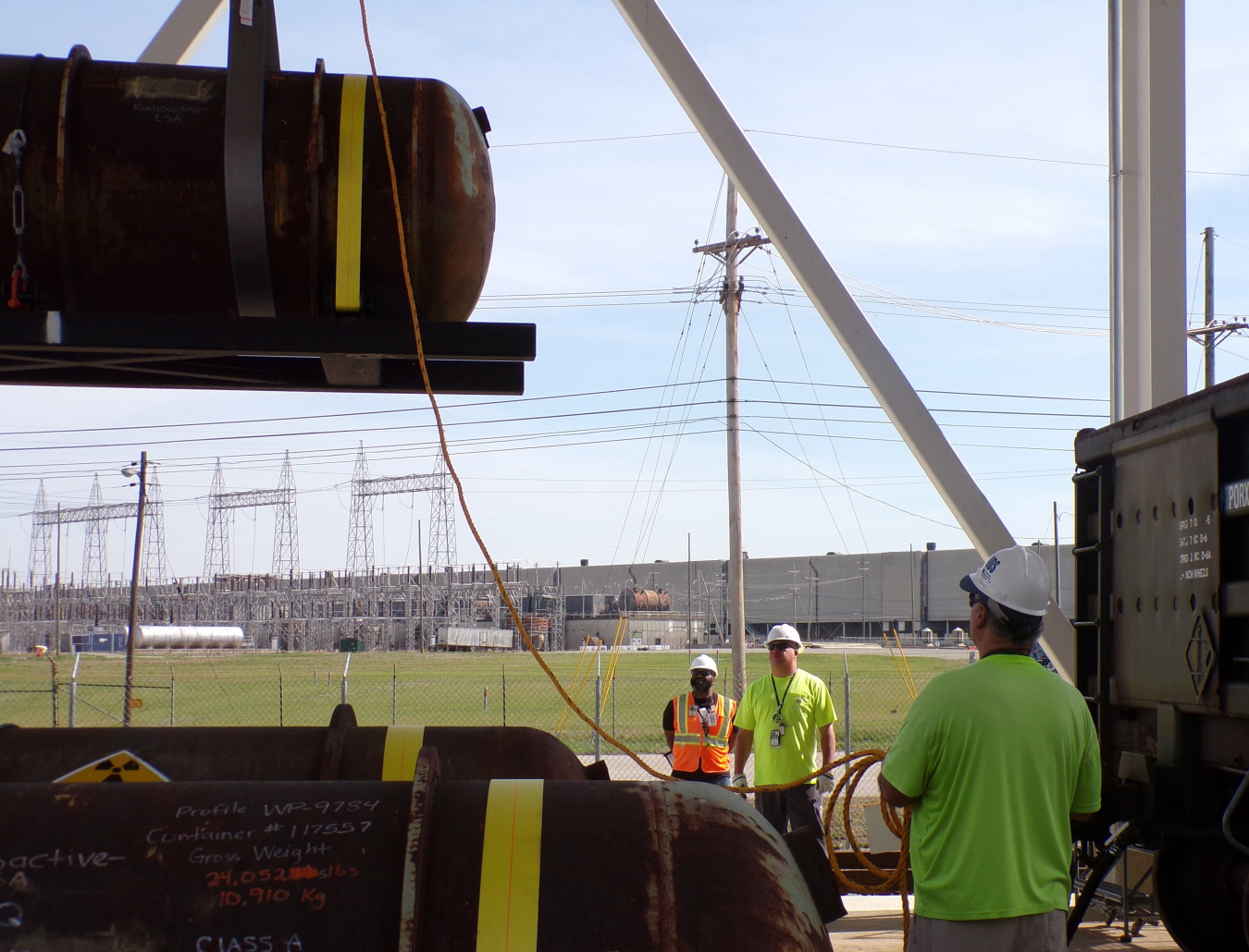 A depleted uranium oxide cylinder is loaded onto a rail car recently for shipment at the Paducah Site.