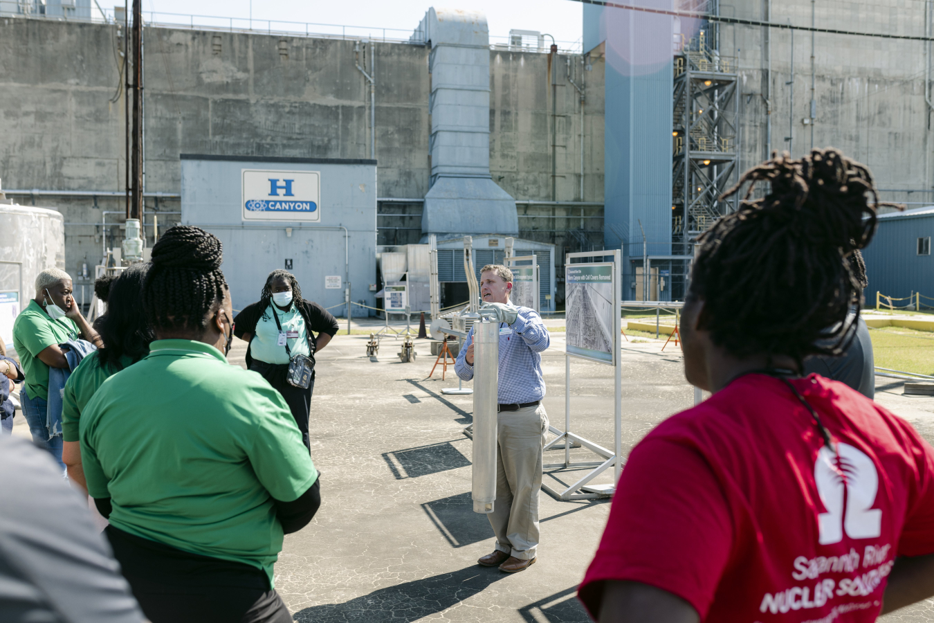 James Therrell, mission planning manager for Savannah River Nuclear Solutions EM operations, discusses vessels and equipment used in H Canyon to educators from Aiken, Orangeburg and Barnwell counties during a tour of the chemical separations facility.