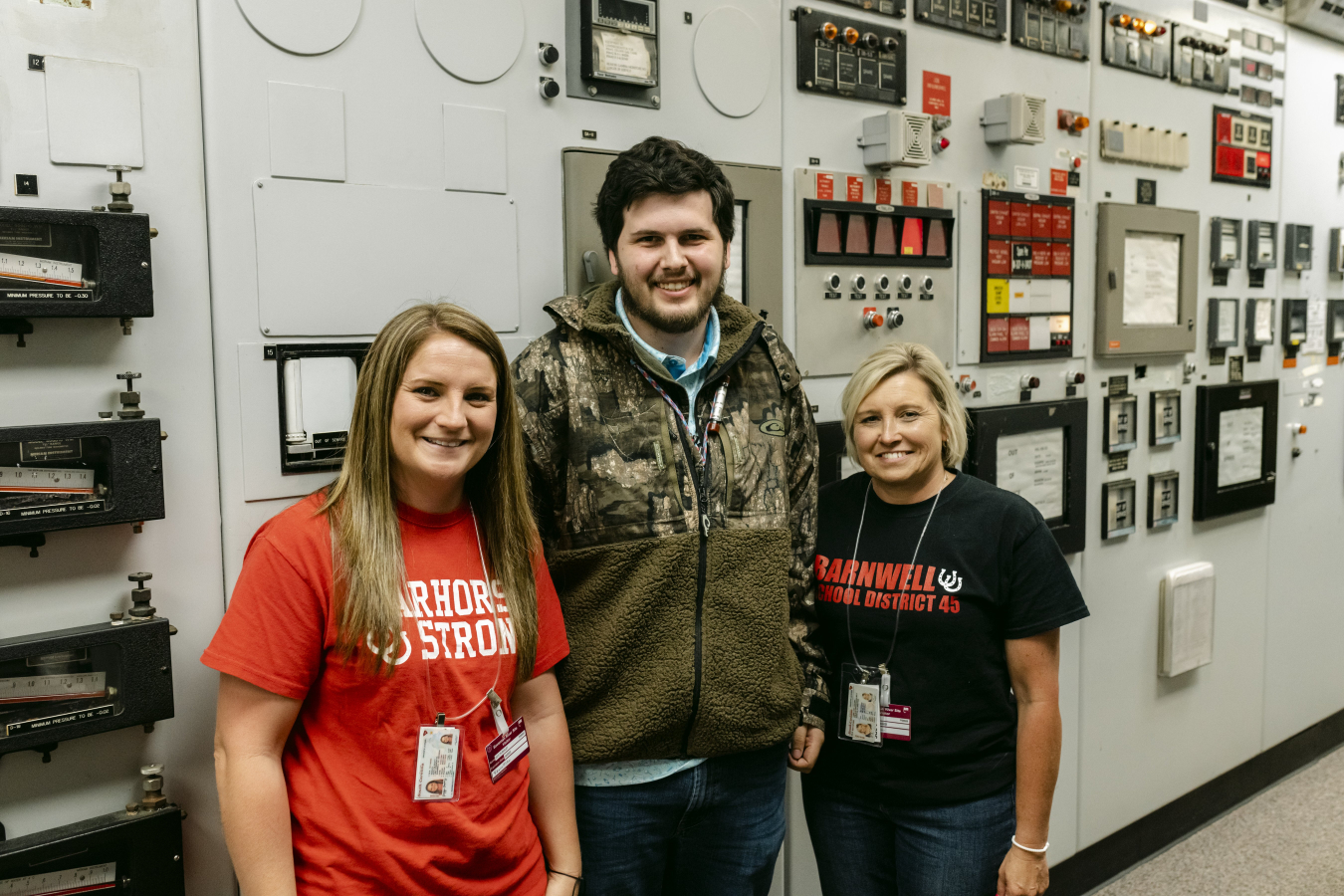 Barnwell High School Career Specialists Kaylyn Baxley, left, and Judy “JJ” Cone, right, reconnect with Dylan Bowen, who is one of their former students and a Savannah River Site employee, during an H Canyon tour.