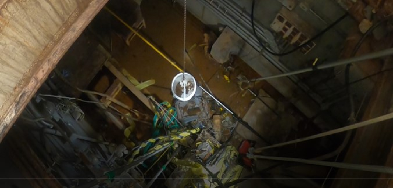 Oak Ridge workers met the challenge of finding and removing a highly radiated item 3 to 4 inches in length from a debris-scattered floor of a former hot cell structure. They searched for the item from a location 25 feet above the floor.