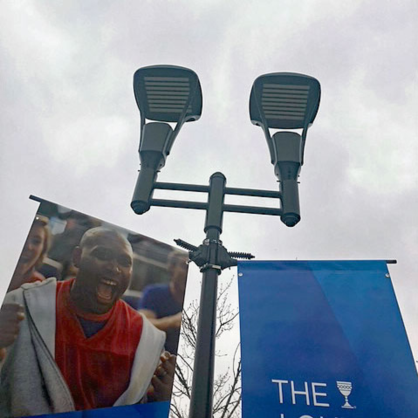 Two lights on an outdoor light post.