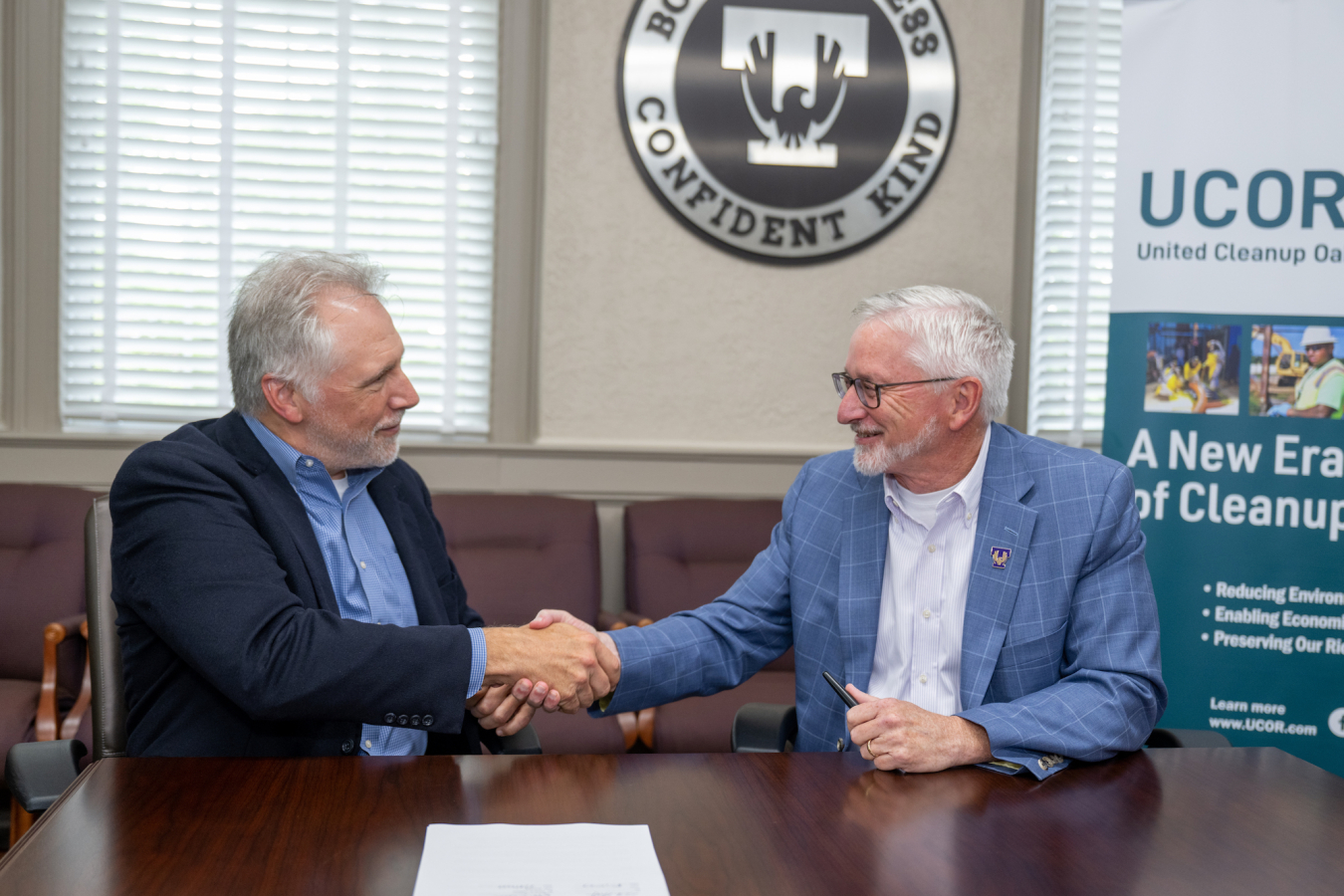 UCOR President and CEO Ken Rueter, at left, and Tennessee Technical University President Phil Oldham sign an agreement formalizing a partnership between the school and the contractor. UCOR will provide resources and expertise to the university as it develops its curriculum. The contractor will also offer internship and career opportunities for students.