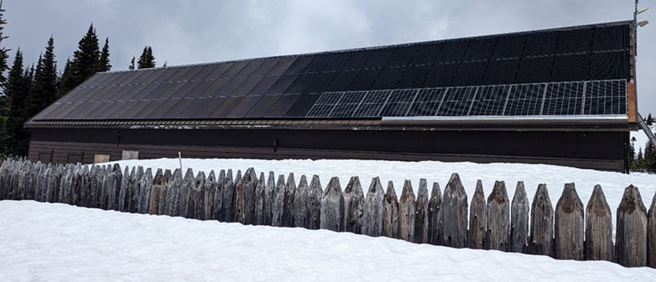 Photo of snow nearly reaching the roof. 