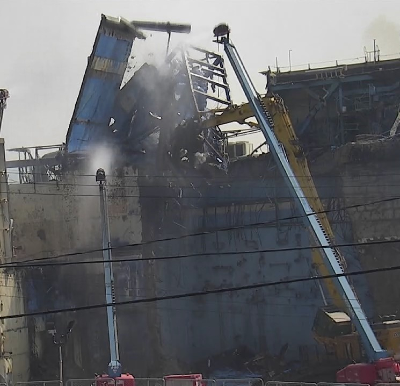 EM workers take down the Chemical Process Cell penthouse at the West Valley Demonstration Project. The enclosure housed a 125-ton shield door used during former nuclear fuel reprocessing operations. The controlled demolition began in September 2022.