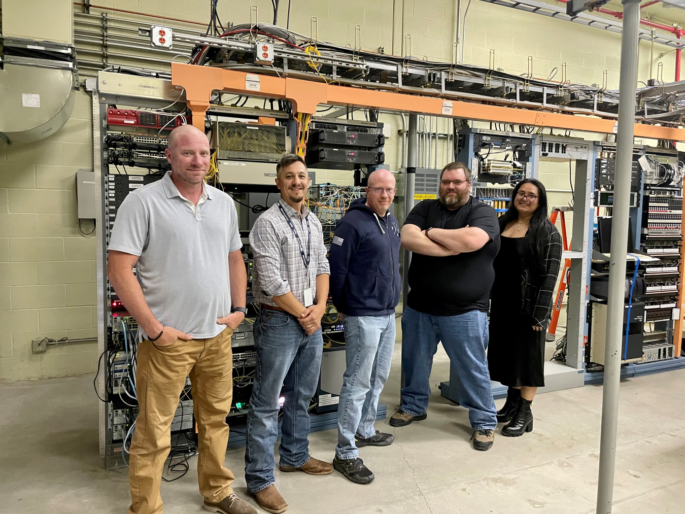 Network and engineering staff from Hanford Mission Integration Solutions (HMIS) and its subcontractor, North Wind Solutions, helped bring Bechtel National Inc. computer users onto the Hanford computer network. From left: Andy Onica, Gavin Creach, and Mike Yale with North Wind, and Phil Budde and Cristal Robinson with HMIS.