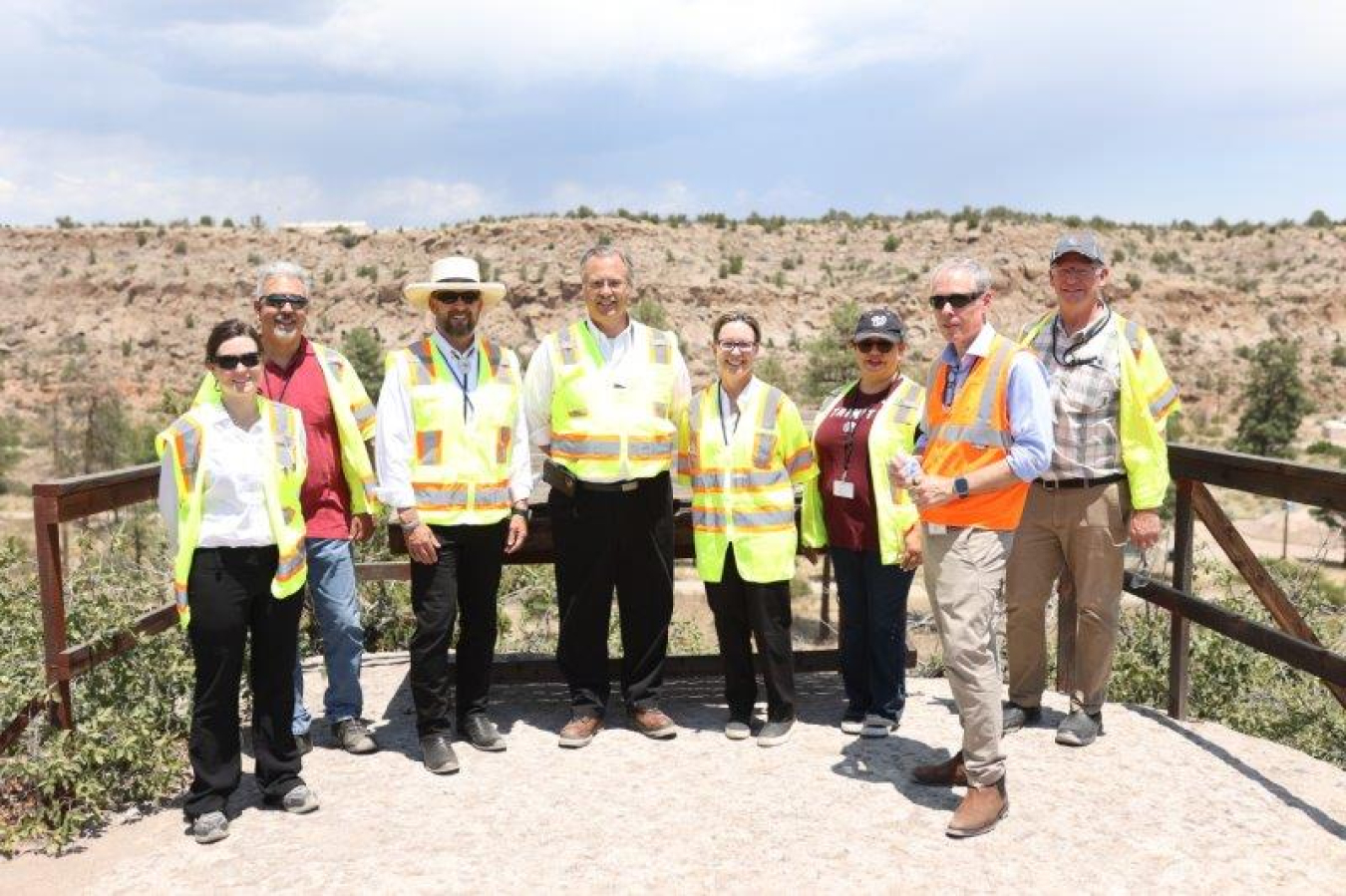 EM Senior Advisor William “Ike” White, second from right, attended a tour with representatives from Los Alamos County to discuss several cleanup sites especially important to the county, including the chromium project area in Mortandad Canyon, pictured, Middle DP Road site and Technical Area 21. From left: Sarah (Ellie) Elizabeth Gilbertson, EM Los Alamos Field Office (EM-LA) deputy manager; James Alarid, deputy utility manager, Los Alamos County Department of Public Utilities; Brad Smith, Newport News Nucl