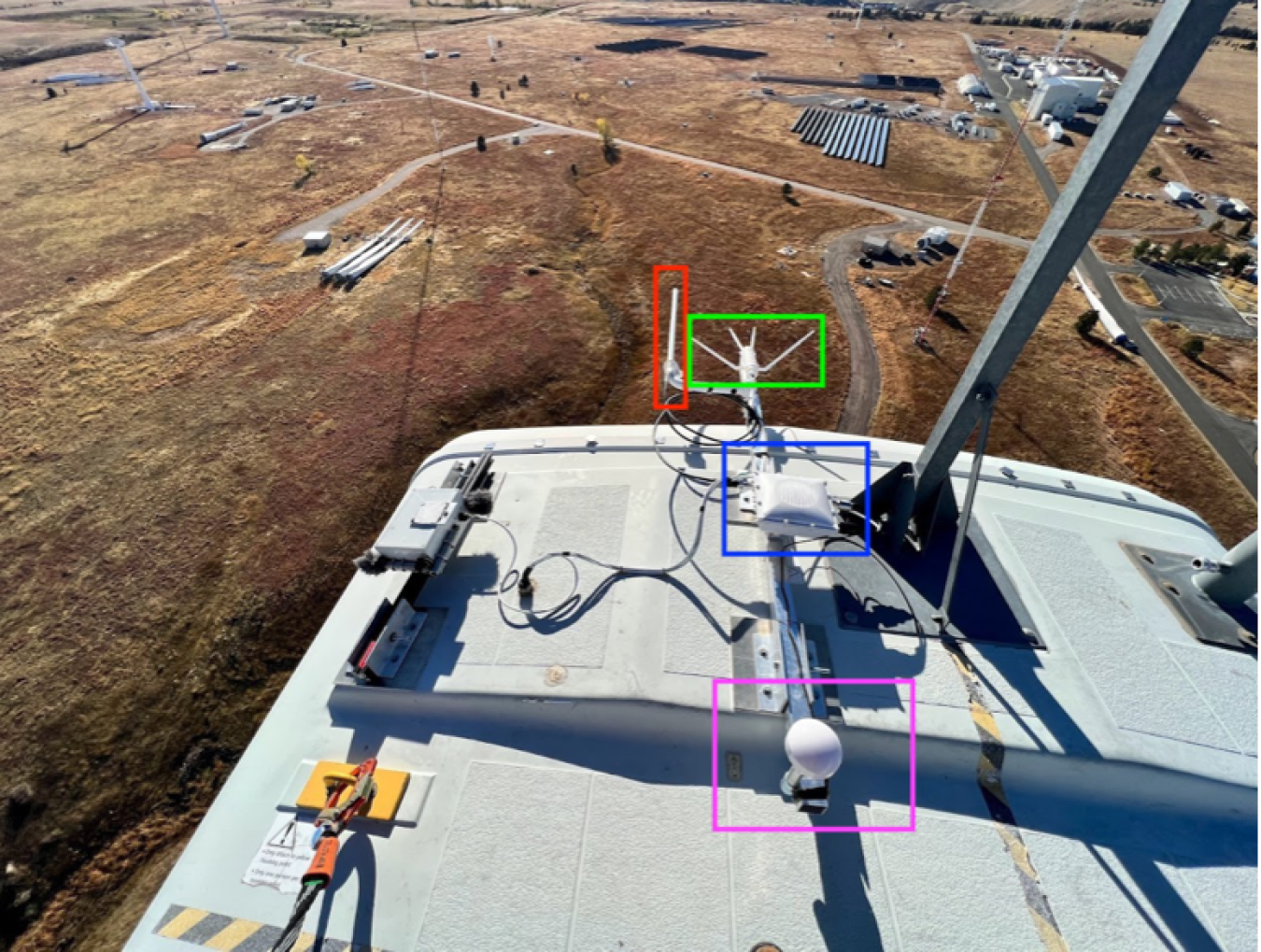 Devices attached to the top of a wind turbine as viewed from on top of that turbine.