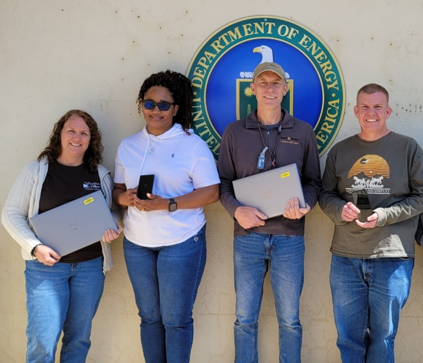 Swift & Staley was recognized as a 2023 Electronic Product Environmental Assessment Tool Purchaser Award winner, marking the fourth time the EM Paducah Site infrastructure support services contractor has won the award. From left are Swift & Staley employees Christa Armstrong, Green Team; Latrice Ford, Property Department; Mike Golightly, Green Team; and John Witte, Information Technology Department.