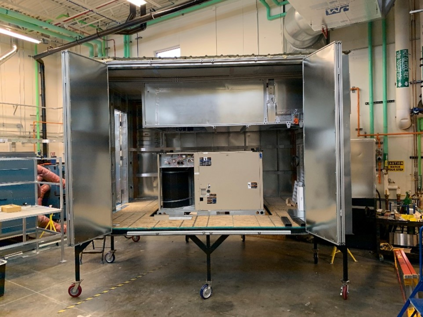 Figure 3. This AOP also funded the development of a dynamic commercial rooftop unit testbed. Compared to typical psychrometric or environmental chambers, this testbed was specifically designed for dynamic and realistic control of an RTU. For example, this RTU can use its economizer to condition based on its control algorithms. This testbed was built leveraging previously installed NREL infrastructure providing a unique experimental capability for GEB HVAC technologies.