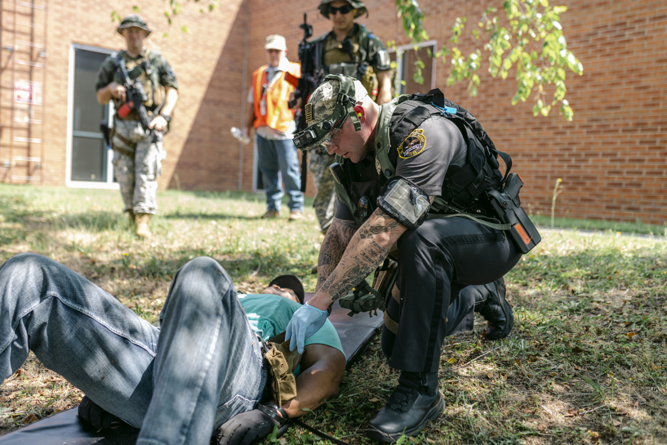 A police officer with Savannah River Site (SRS) security contractor Centerra-SRS collects evidence from an SRS employee who agreed to play the role of an active shooter during an emergency response exercise earlier this year.