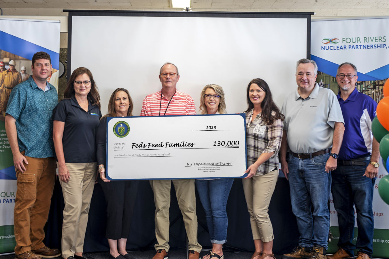 From left, Enterprise Technical Assistance Services Project Manager Nathan Miller, Four Rivers Nuclear Partnership (FRNP) Program Manager Myrna Redfield, Mid-America Conversion Services (MCS) campaign coordinator Meg Kelley, EM Paducah Site Strategic Planner Robert “Buz” Smith, Swift & Staley (SSI) Project Manager Tammy Courtney, SSI campaign coordinator Amanda Scott, MCS Program Director Rob Gentry and FRNP campaign coordinator Steve Christmas.