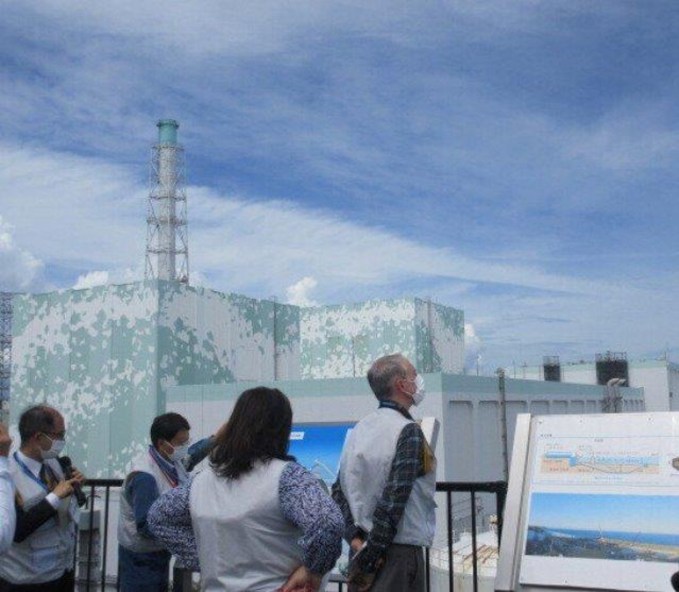 Ike White, EM senior advisor, and delegation view the progress underway at the Fukushima Daiichi NPS. 