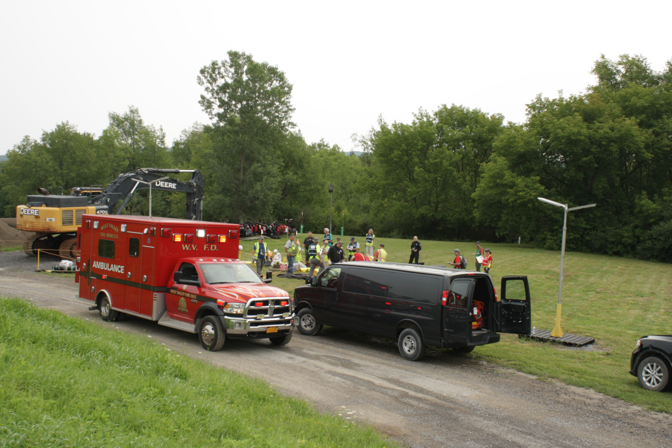 Members of the Emergency Medical Response Team at the West Valley Demonstration Project arrive at the staged scene of an emergency response exercise to provide immediate care to employees with mock injuries from a simulated equipment fire.