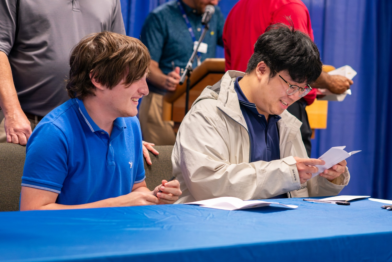 Savannah River Nuclear Solutions engineering interns Cole Rappold, left, and DoHyeon Mason sign and accept their job offers with the Savannah River Site during the “Signing Day” event.