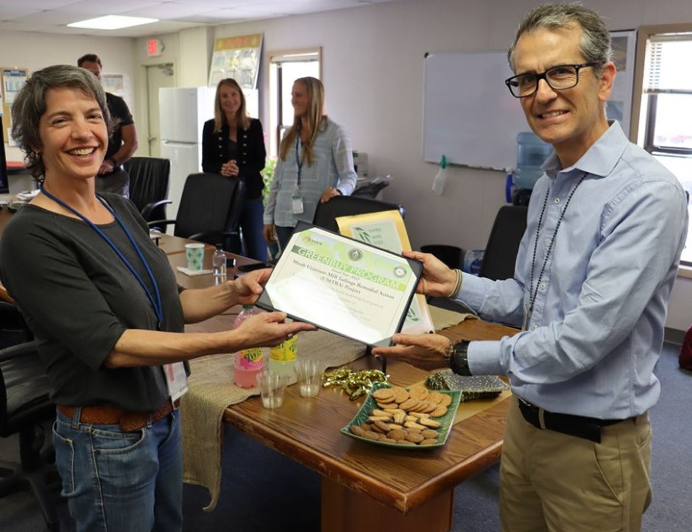 EM Sustainability Program Manager Albes Gaona presents GreenBuy Awards to contractor Katrina Lund, the Moab Uranium Mill Tailings Remedial Action Project’s environmental compliance manager, during his visit to the site earlier this year. The Moab Project received two GreenBuy Awards for excellence in “green purchasing” for fiscal year 2022. EM headquarters congratulated both the Moab Project and the Environmental Management Consolidated Business Center, which oversees the Moab Project.