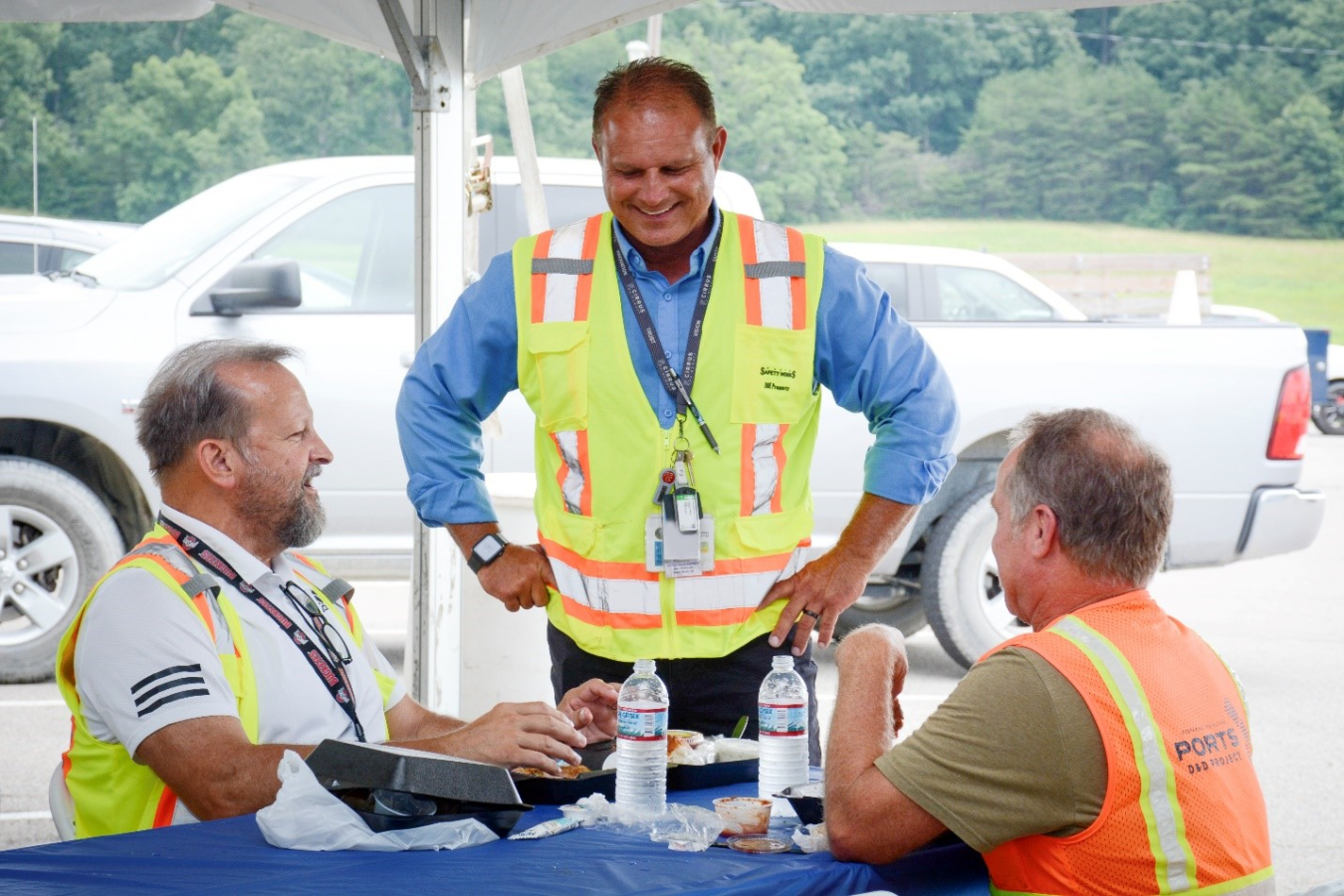 Fluor-BWXT-Portsmouth Site Project Director Greg Wilkett, center, talks to Whiz Detty, left, and Tom Graf at a celebration marking 4 million safe work hours recently held at the Portsmouth Site.