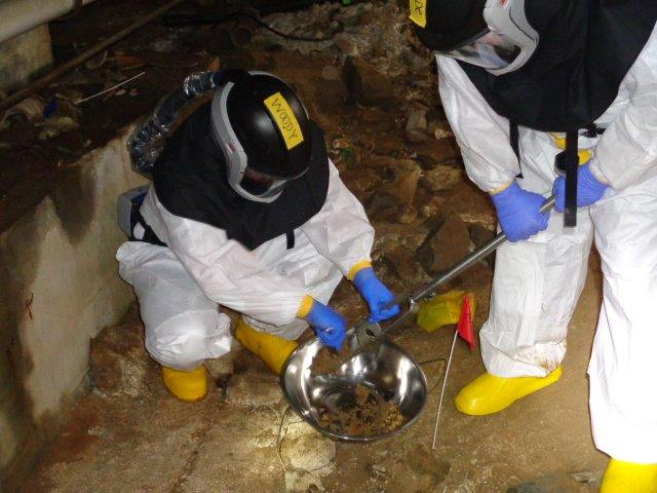 EM crews take samples in the basement of Alpha-2. They are scheduled to begin deactivation in that space later this year.