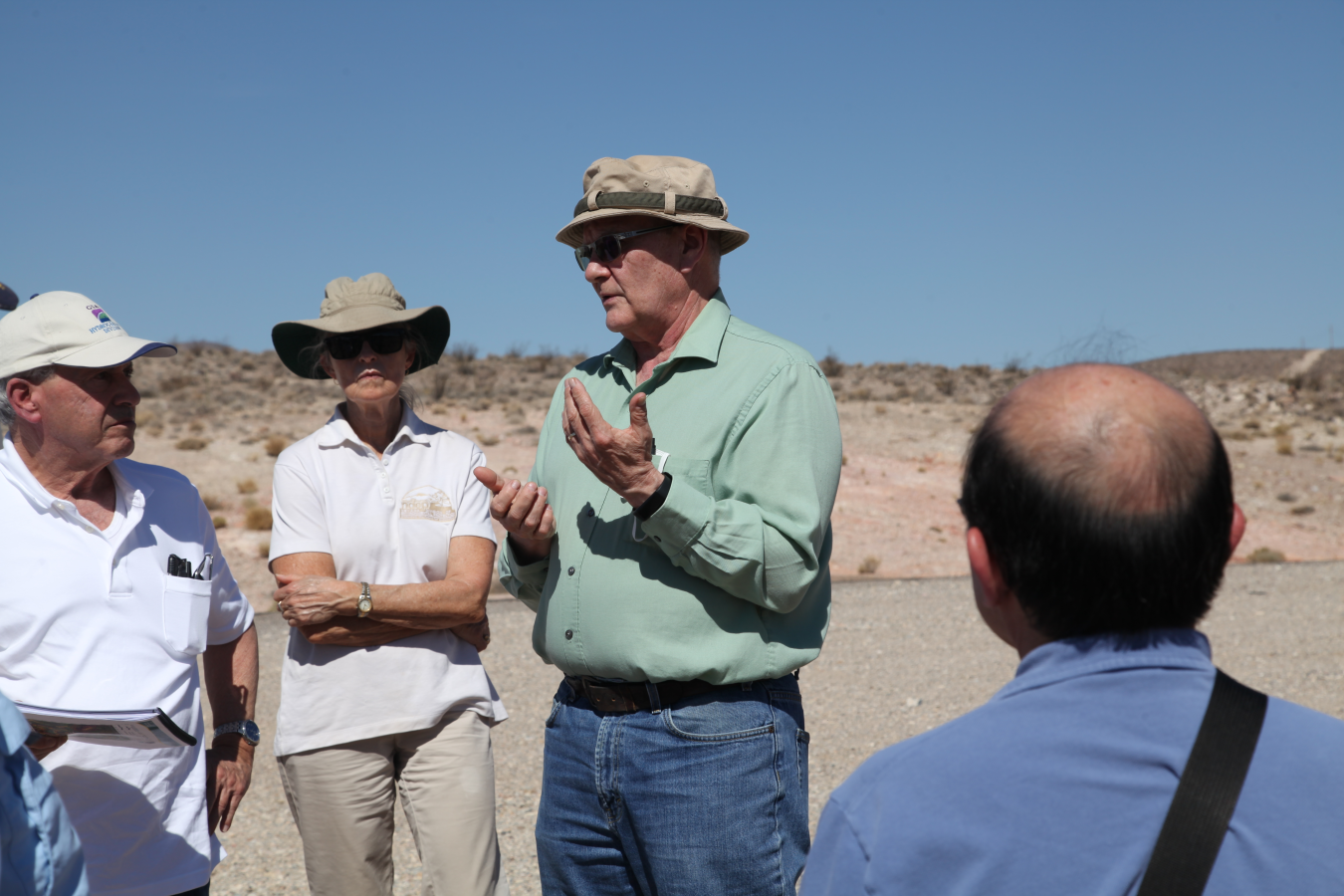 Ken Rehfeldt speaking to group in Oasis Valley