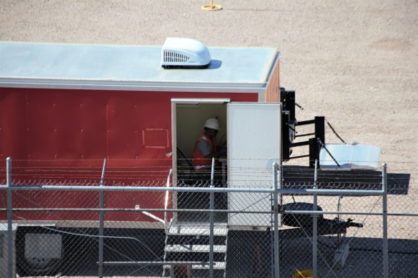 Nevada TCC worker in red building