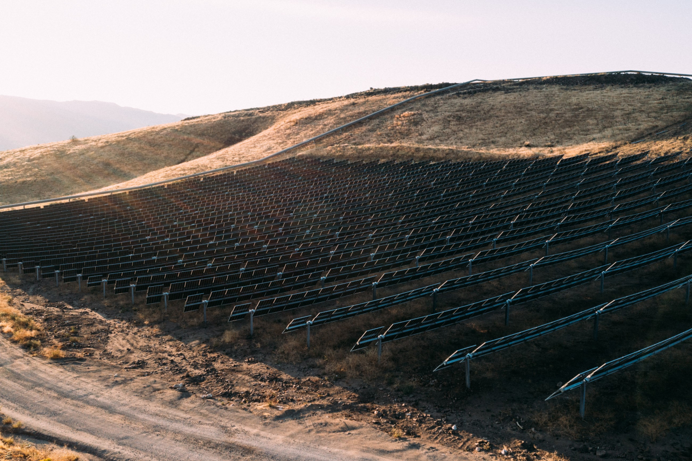 Photo of an 11-megawatt solar array equipped with Nevados trackers on sloped ground in Reno, Nevada