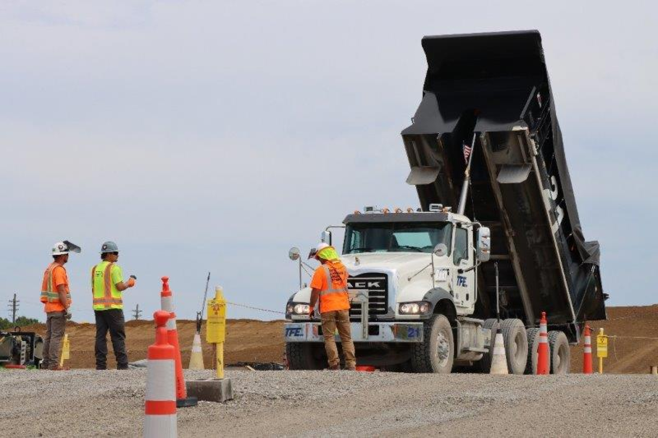 Photo of work crew and dump truck