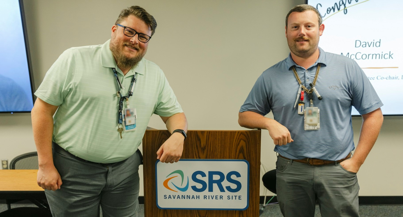 Photo of two men at podium