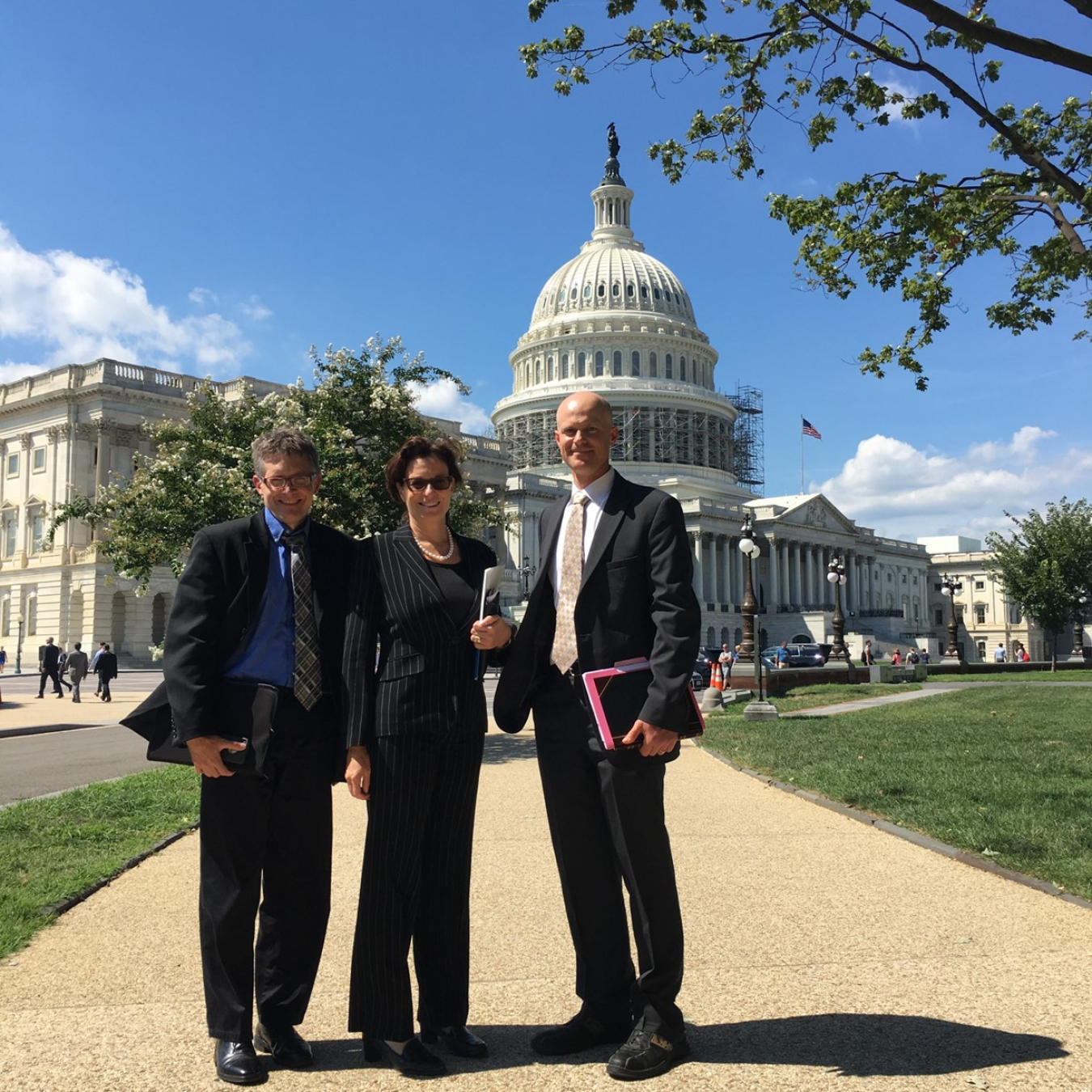 Donna Rennemo with Idaho National Lab staff Tim McJounkin and Ryan Bills after a presentation in Washington, D.C.