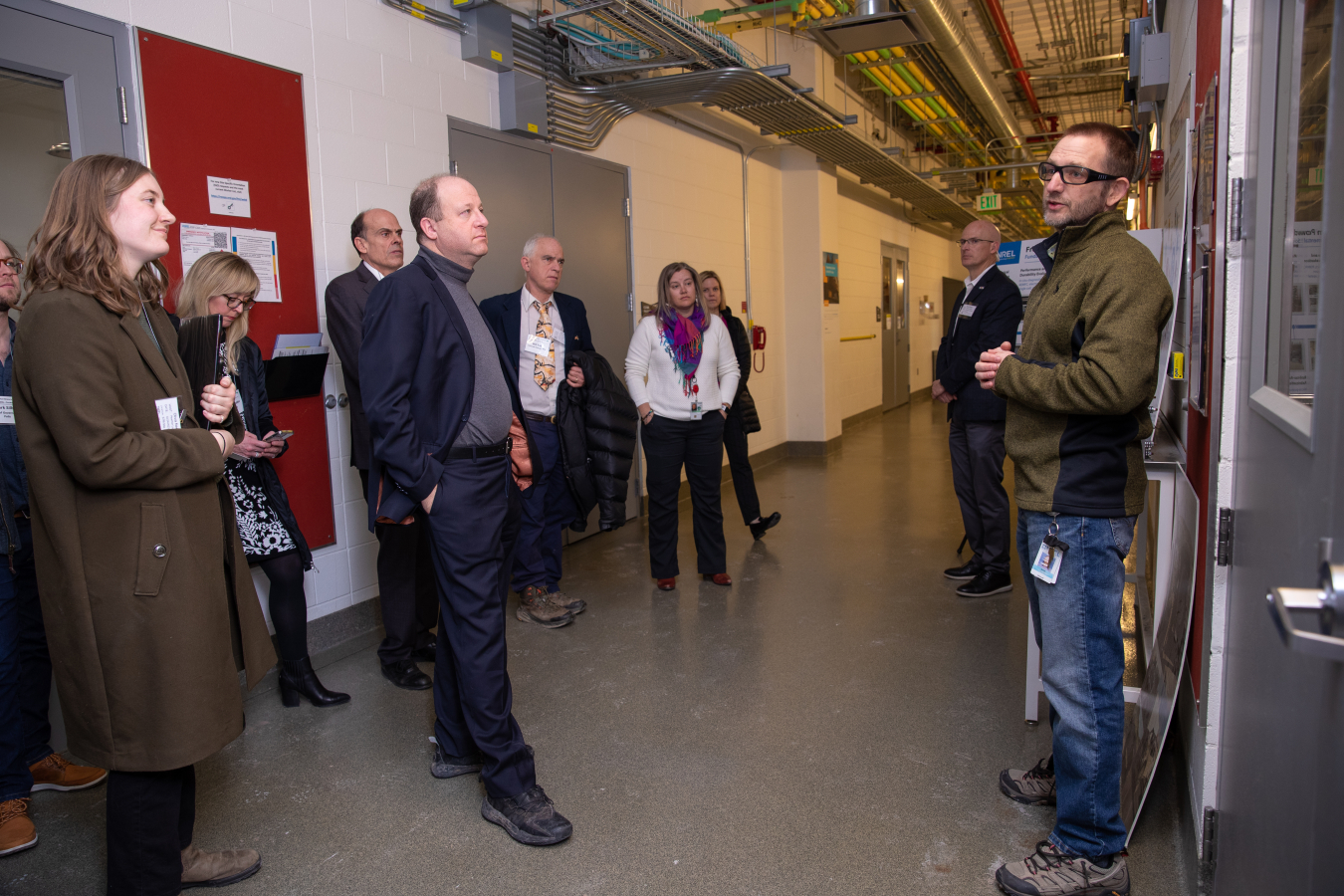 Colorado Governor and WGA 2023 Chair Jared Polis and other WGA members receive a tour of the National Renewable Energy Laboratory campus.