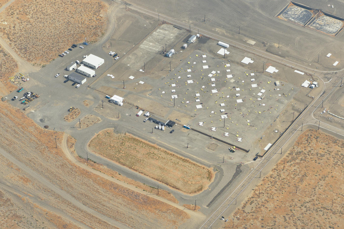 An aerial of the Hanford Site’s U Tank Farm and its runoff basin before workers installed the surface barrier.