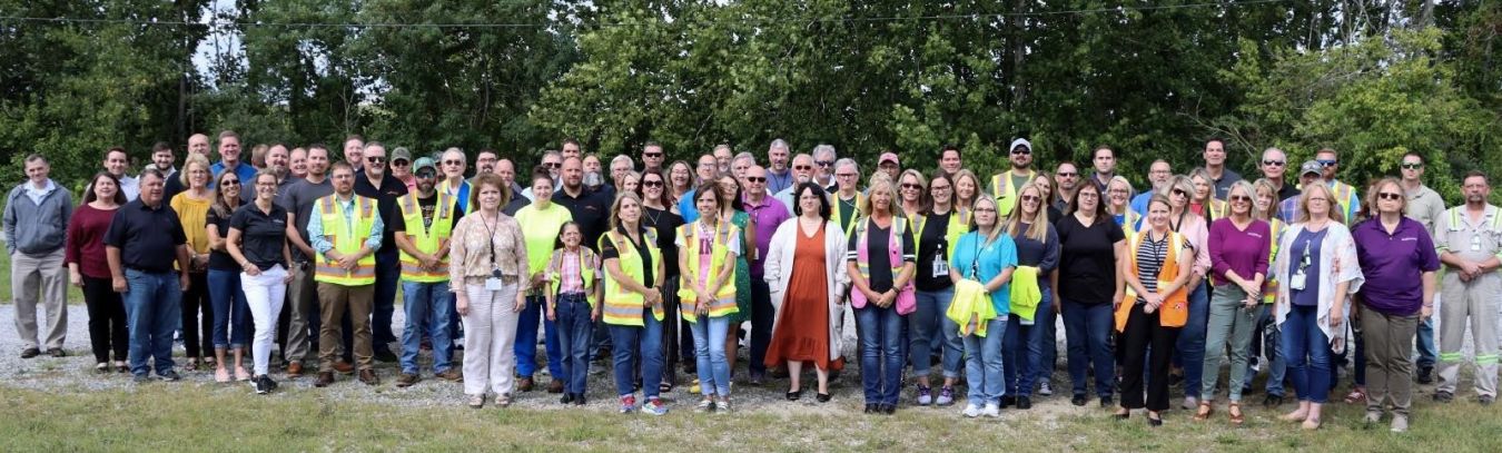 Large group of employees pose for a picture