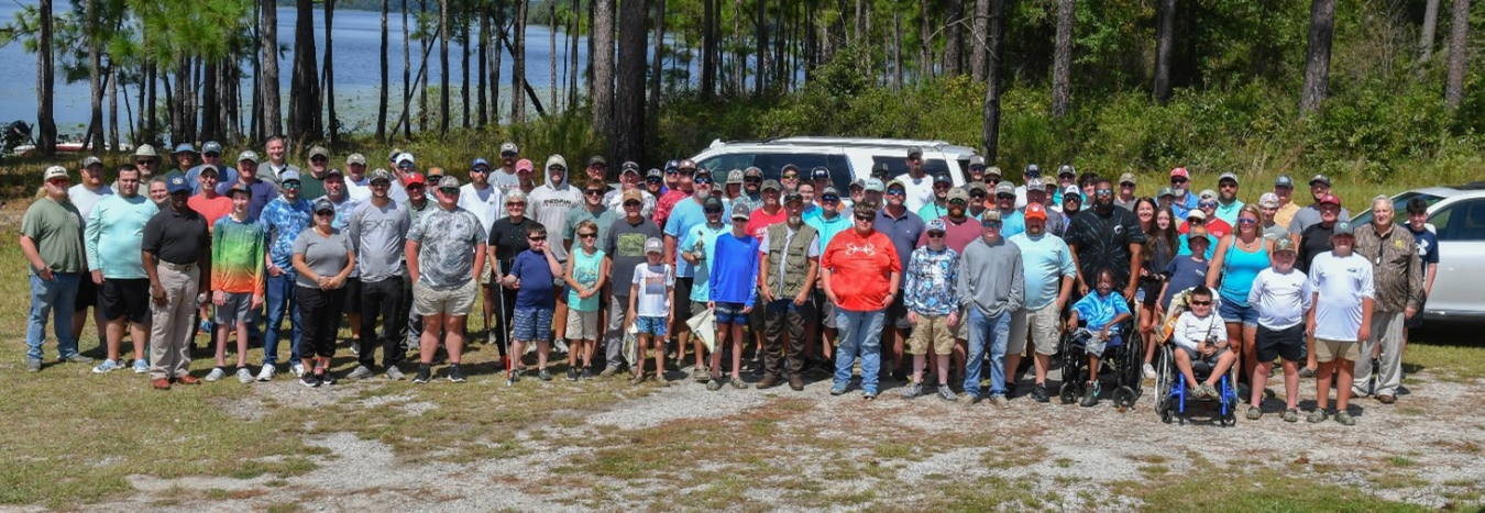 A large group of participants pose for a picture