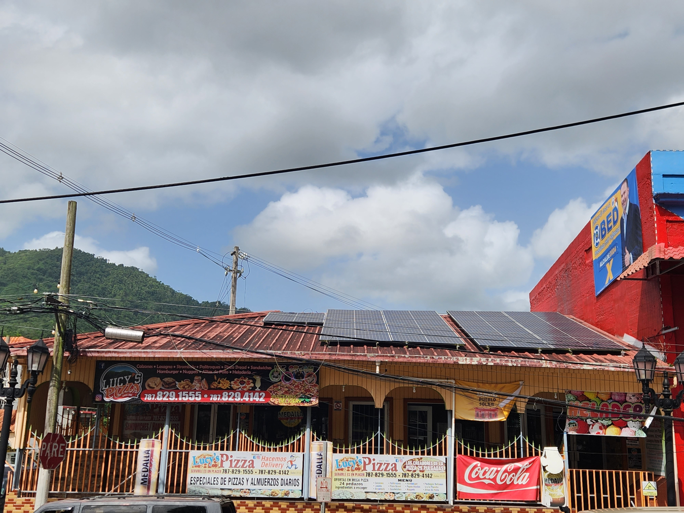 Solar panels can be seen on the rooftop of a pizza restaurant in Puerto Rico. 