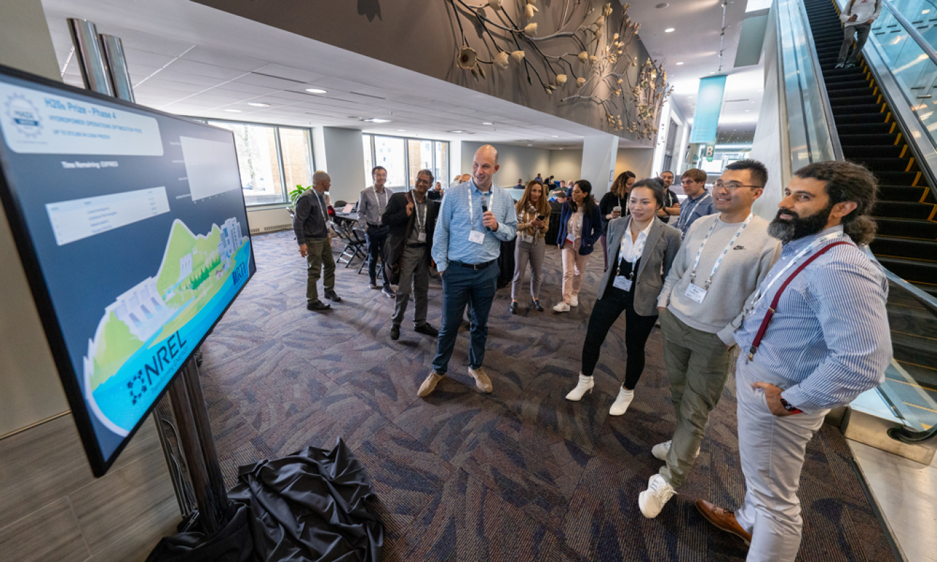 Clayton Barrows, H2Os Prize principal investigator, watches the leaderboard with competitors.