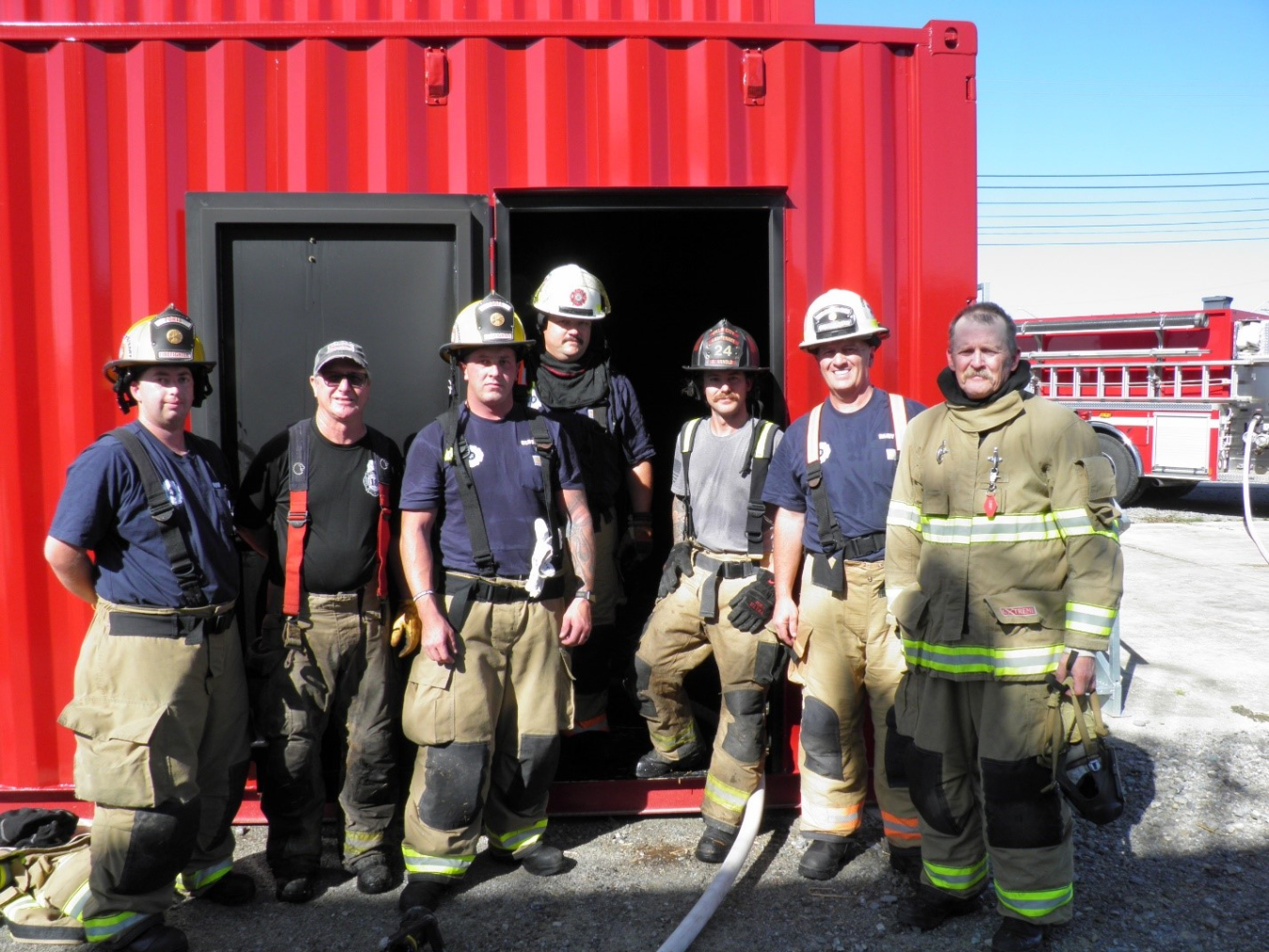 A group of firefighters pose for a picture