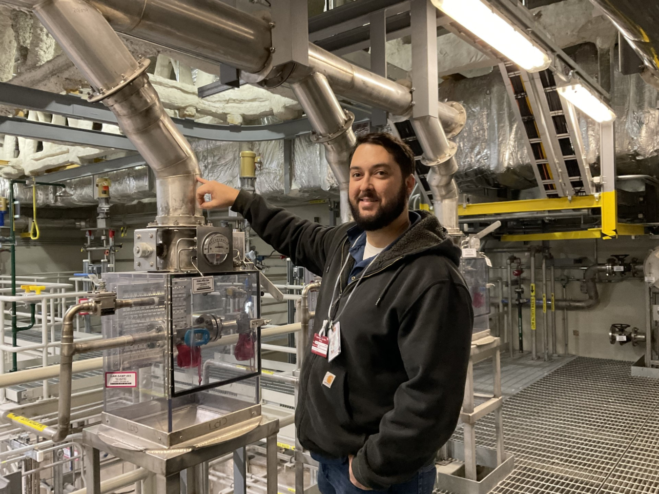 A man stands in a lab building 