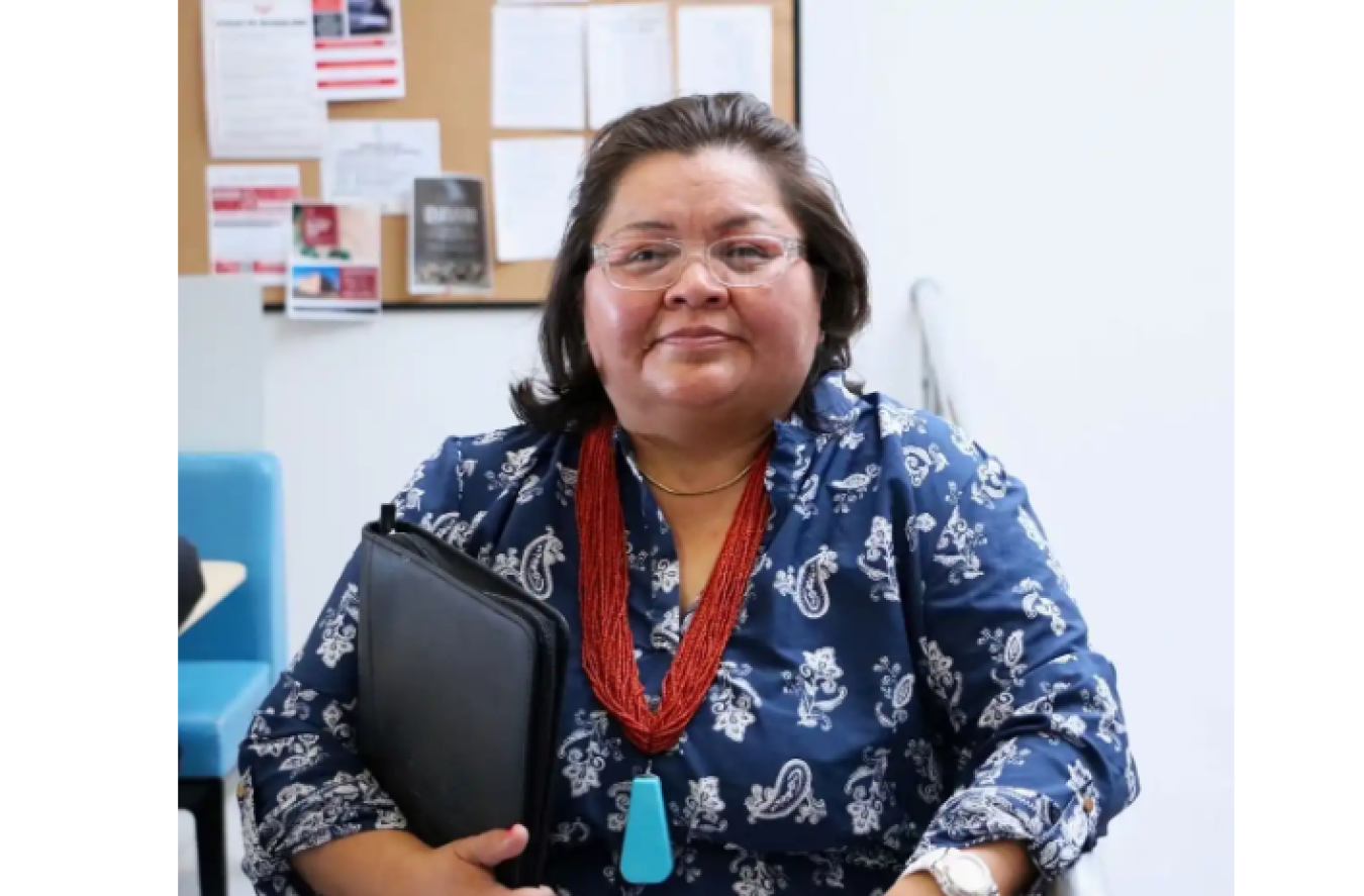 Photo of Felicie Trebian holding a portfolio