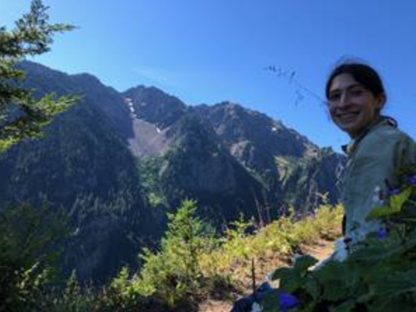 Julia Indivero smiling with mountains in the background