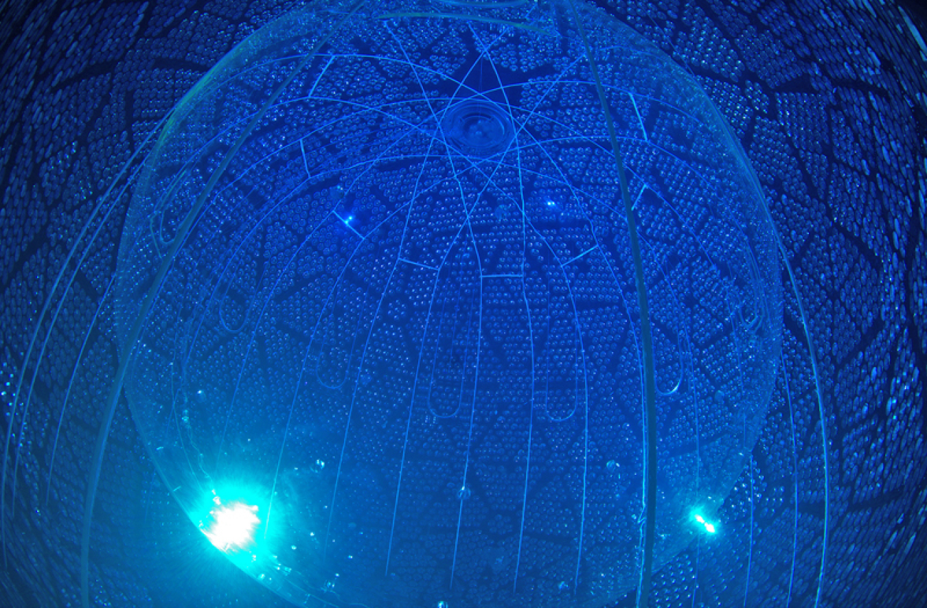 A huge clear sphere full of water surrounded by another sphere with tiny tubes embedded in the walls. The entire thing is blue.