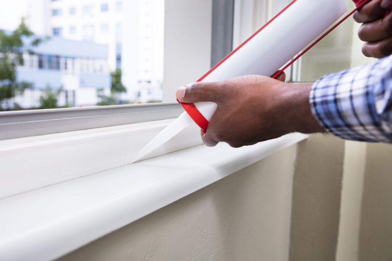 Caulking a window frame