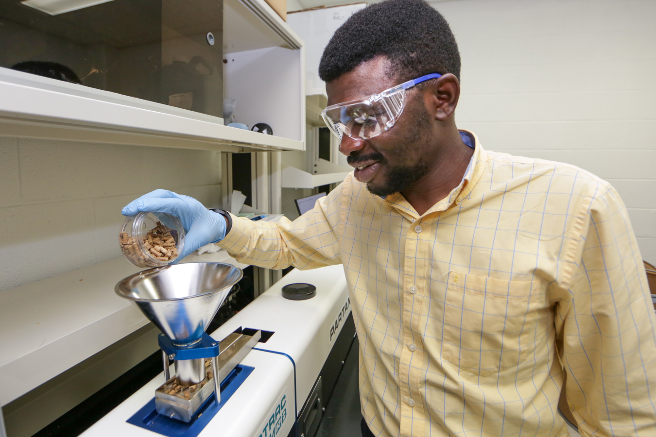 A researcher evaluates how biomass physical properties impact high-temperature conversion into biofuels and bioproducts. 