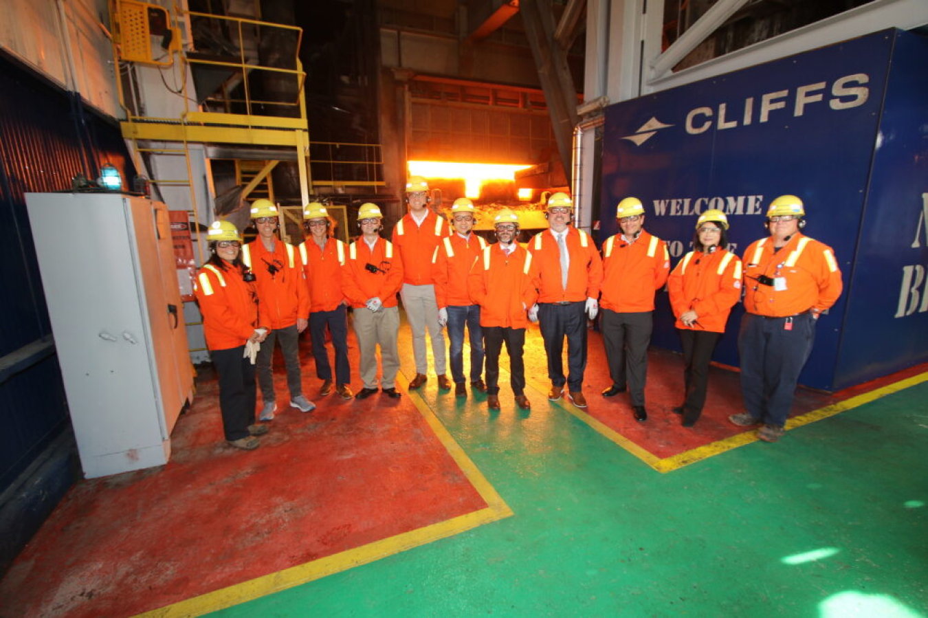 IEDO staff and Cleveland-Cliffs employees pose in front of an industrial furnace at the Indiana Harbor complex in Northwest Indiana, one of the largest steelmaking facilities in North America.