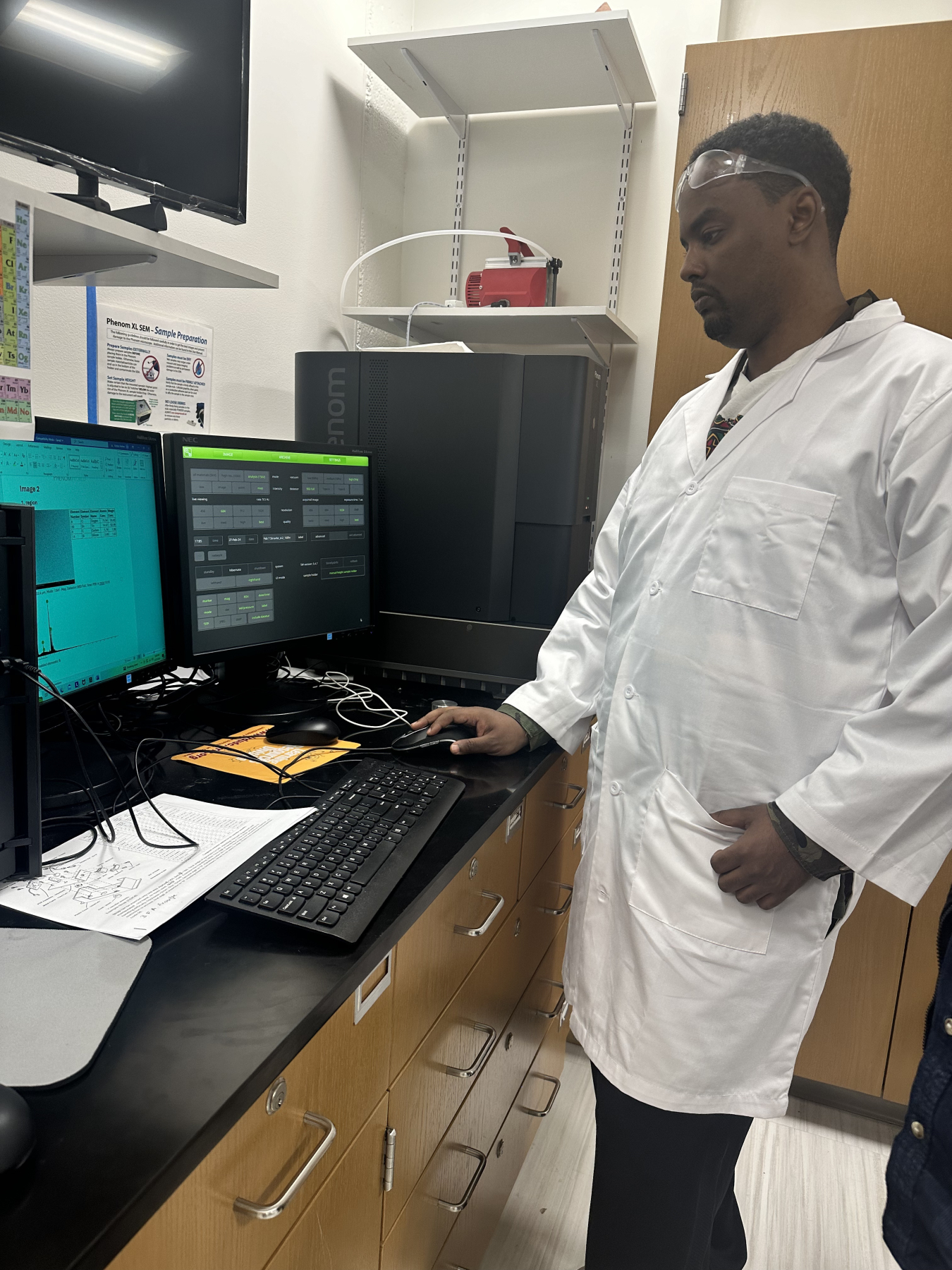 Tewelde Semere working on a computer in a lab