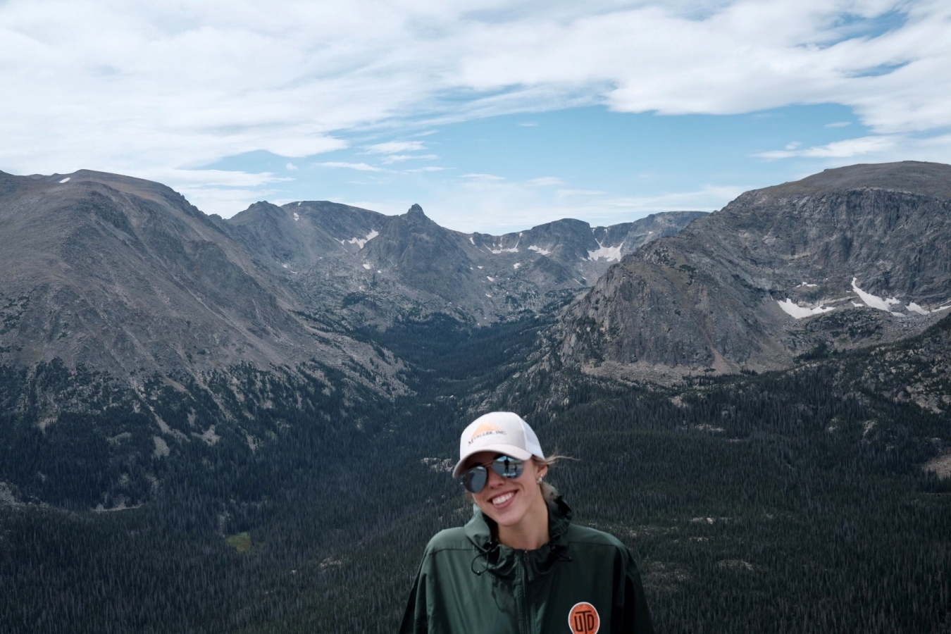 Phoebe Devos-Cole in front of a mountain.