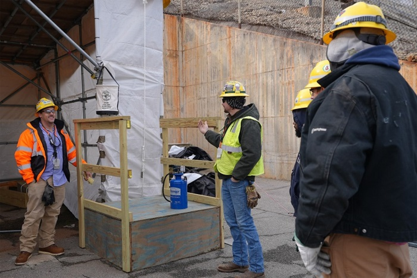 Men in hard hats in teaching scene