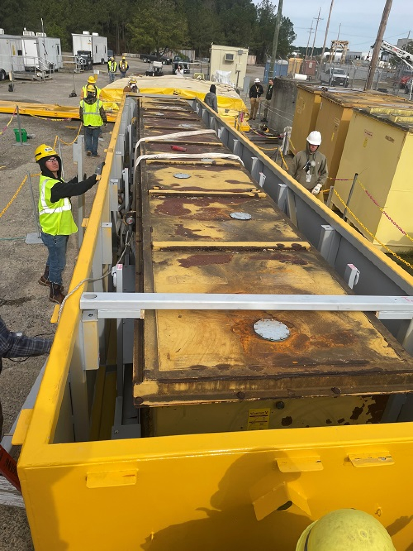 Workers securing boxes for transport