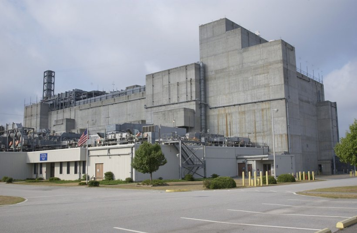 Grey building with smaller white building in front